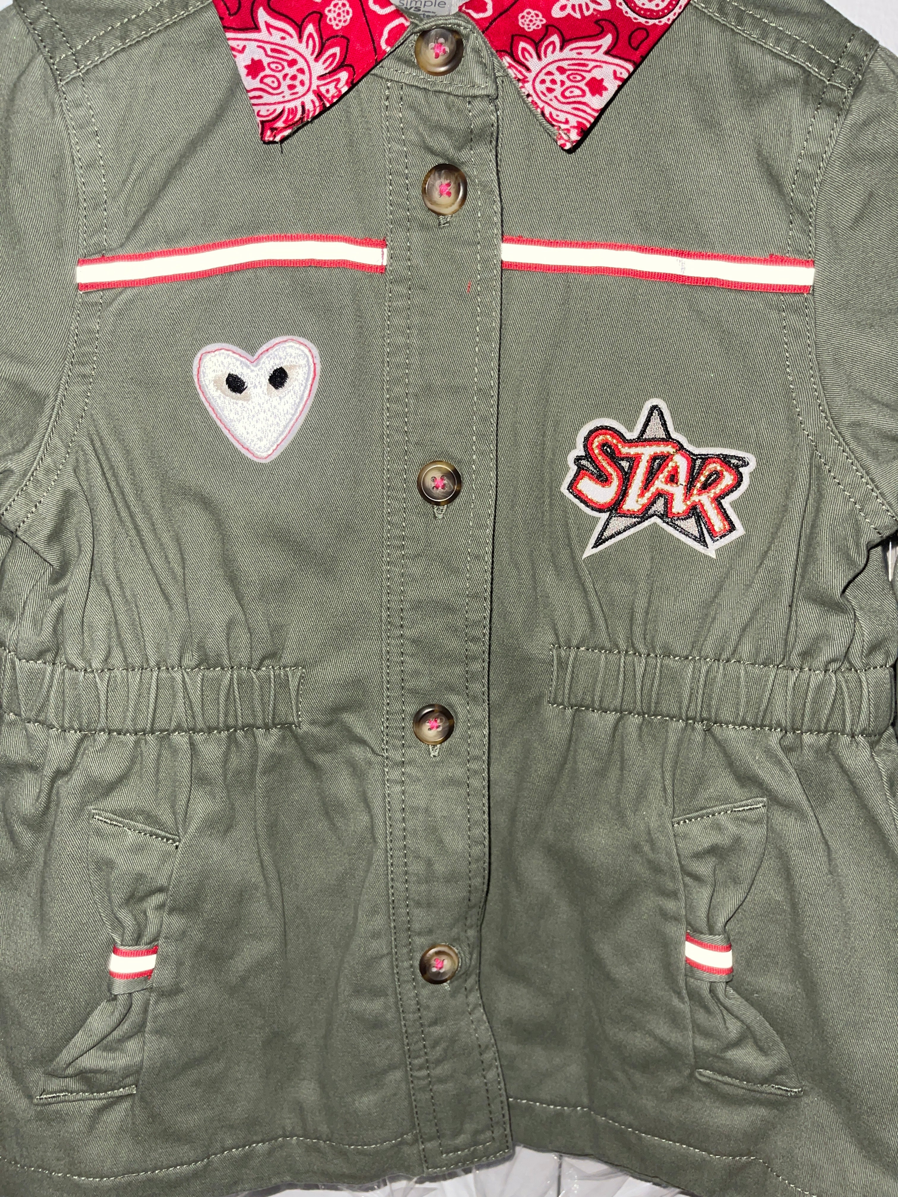 "It's Only Rock and Roll But I Like It", Military-Inspired with Sequin Stars and Other Patches Jacket.